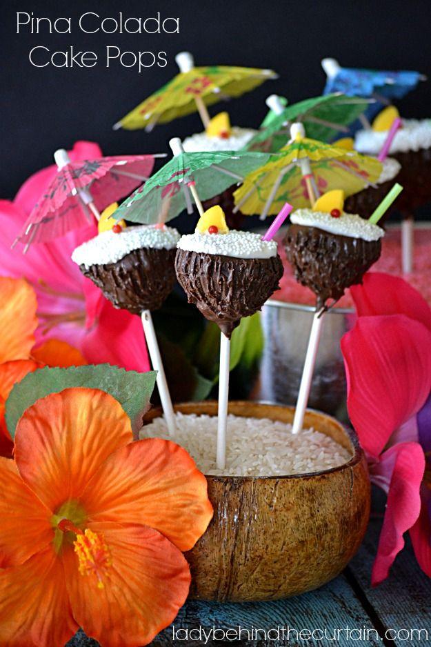 Pina colada cake pops dipped in dark chocolate for a coconut shell look, a tropical party dessert for a luau table