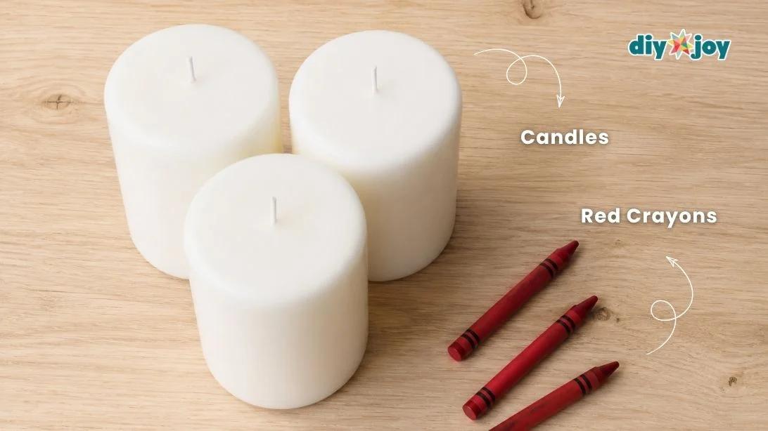Supplies to make bloody candles: white pillar candles, red crayons, and parchment paper, a materials list for Halloween.