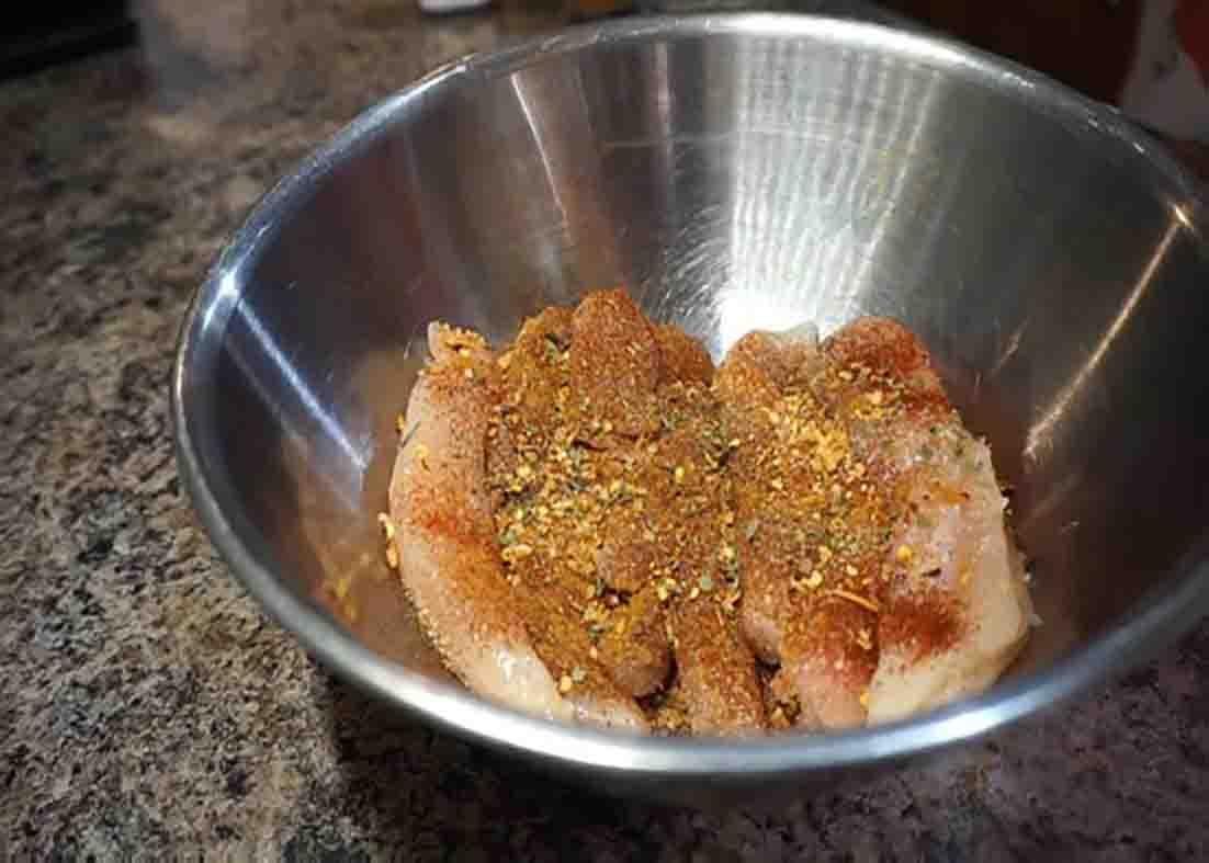 Seasoning the chicken tenders