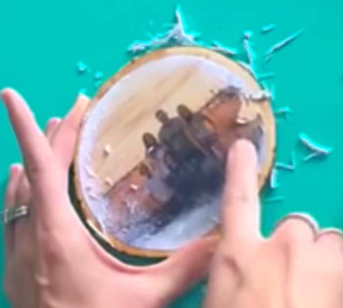 Learn to make a DIY Photo Transfer Ornament onto a slice of wood from Michael's Craft Store