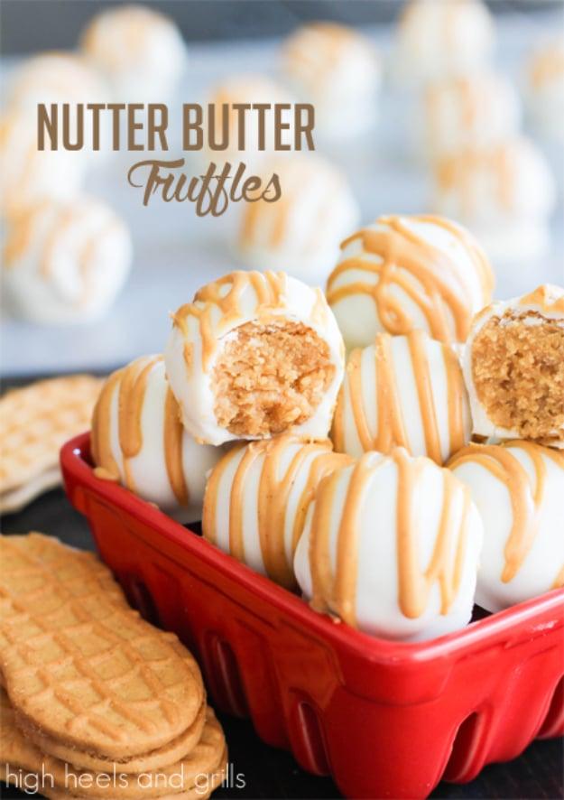 Nutter Butter truffles dipped in white chocolate with a peanut butter drizzle, an easy no bake dessert idea