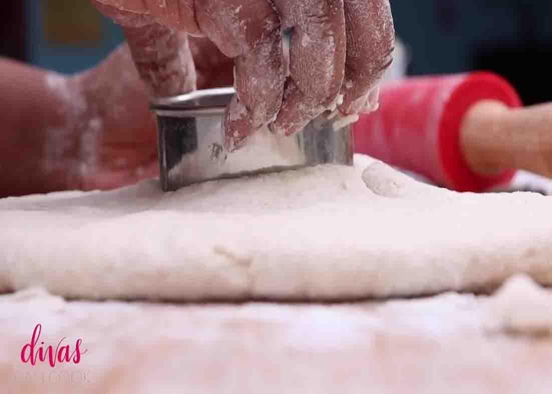Cutting the dough to make the buttermilk biscuits