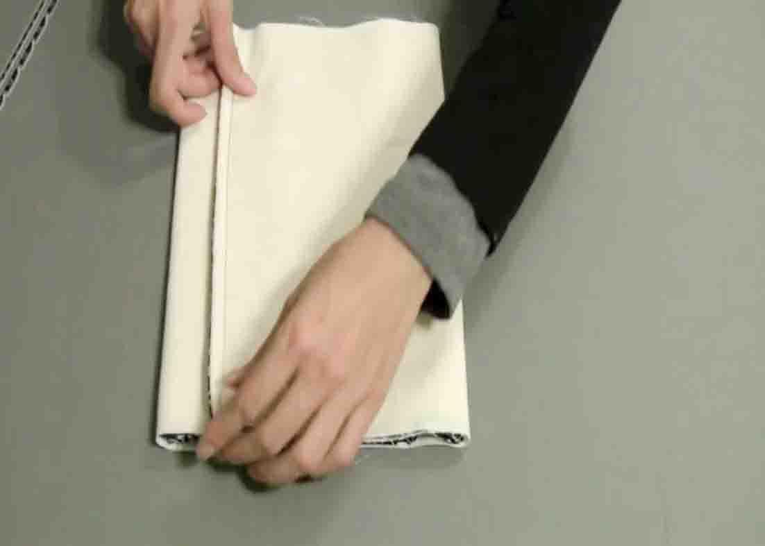 Folding the potato bag before sewing