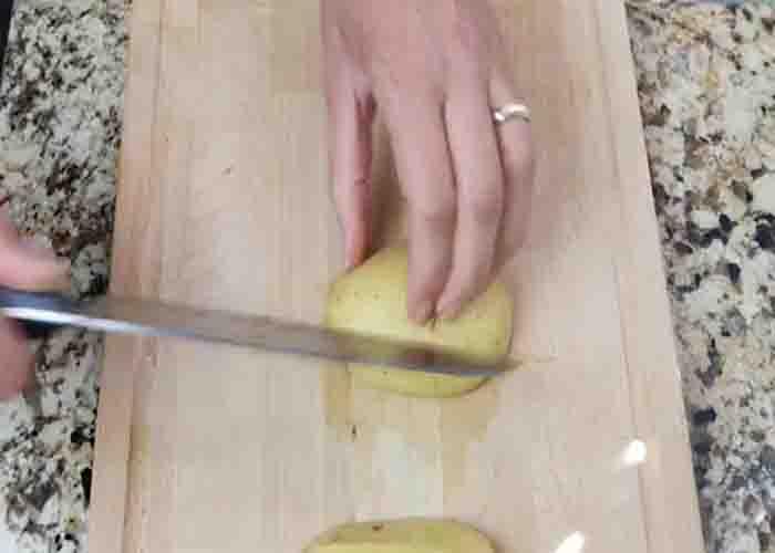 Cutting the potatoes into wedges