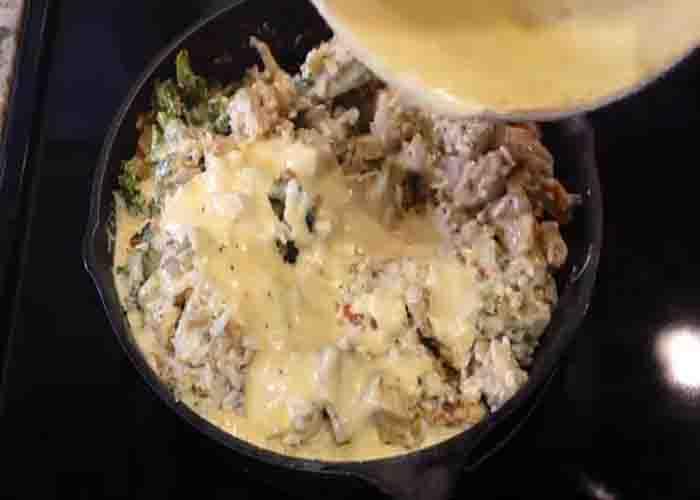 Mixing all the ingredients of chicken broccoli rice casserole