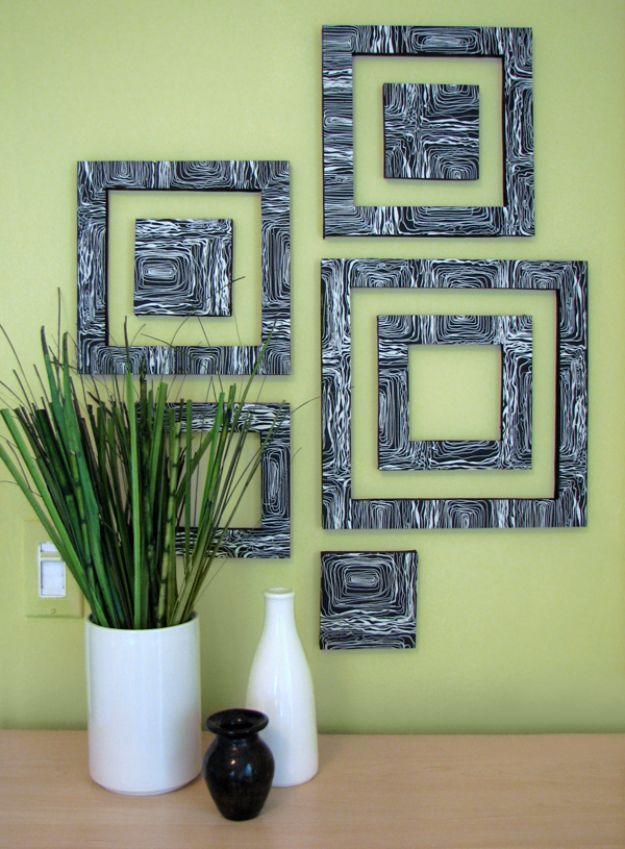 Grouping of concentric square frames covered in black and white marbled paper arranged on a lime green wall