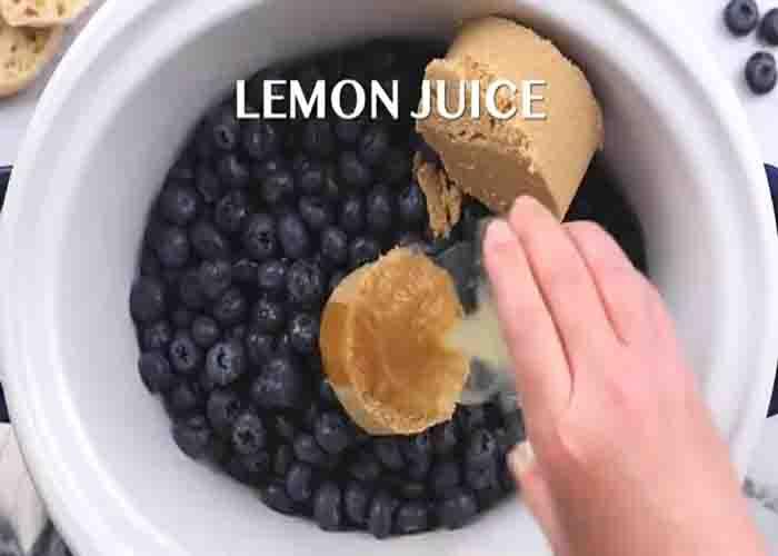 Adding the blueberry butter ingredients to the slow cooker