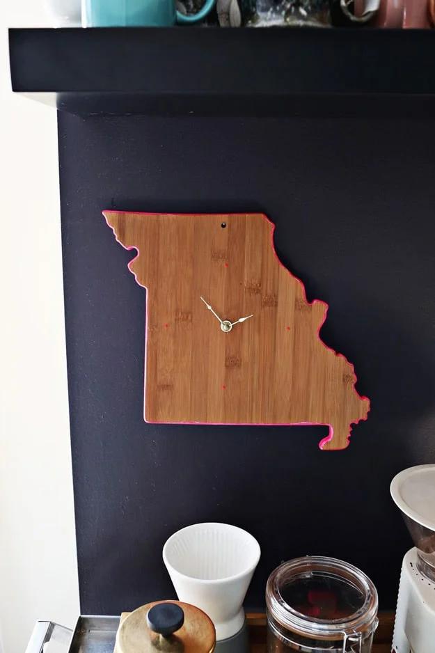 Wooden cutting board upcycled into a wall clock with a drill and clock kit, a rustic craft that photographs well for Etsy