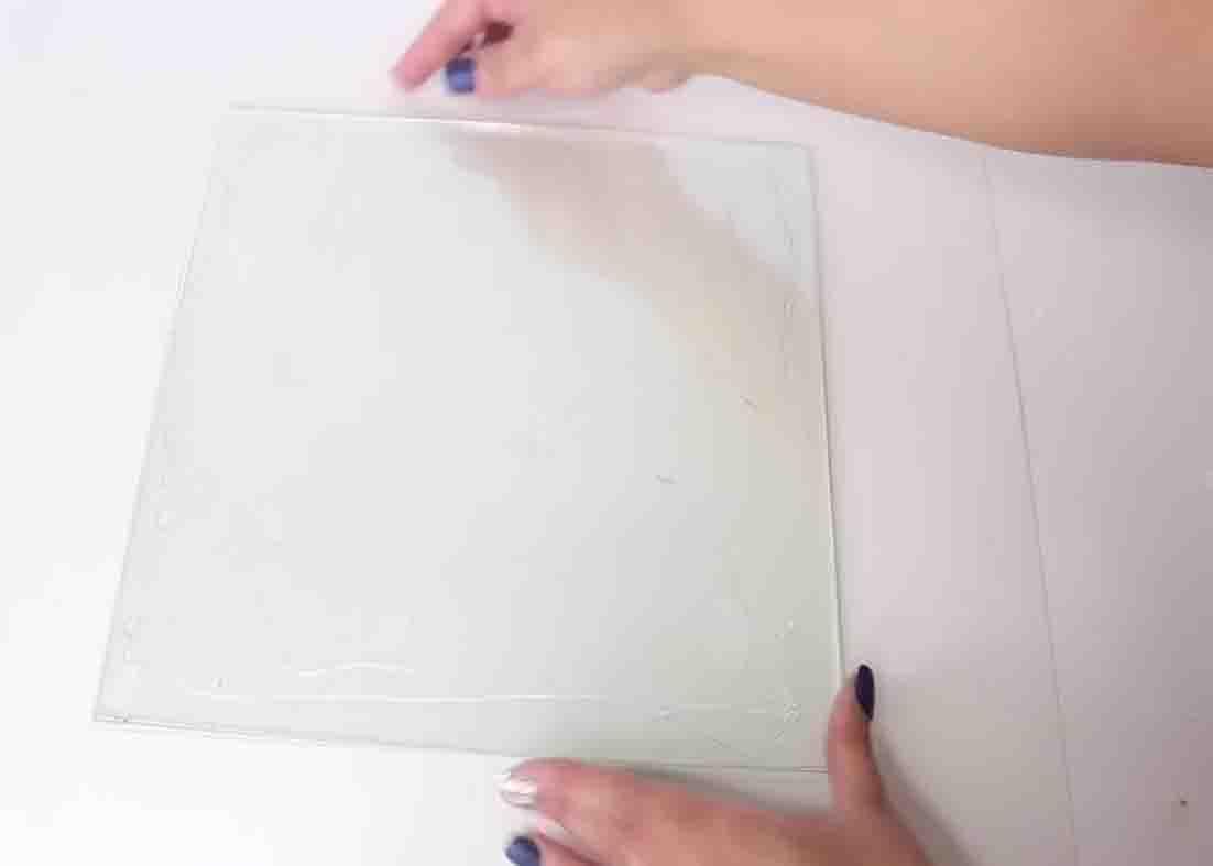 Attaching the glass frames for the DIY faux wood tray
