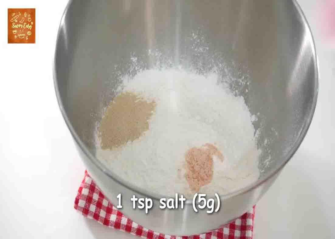 Combining all the dinner rolls ingredients into a bowl