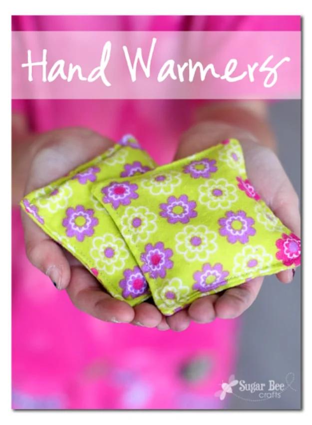 Two small squares of flannel sewn into rice hand warmers, sitting on a wool coat pocket beside a pile of fabric scraps