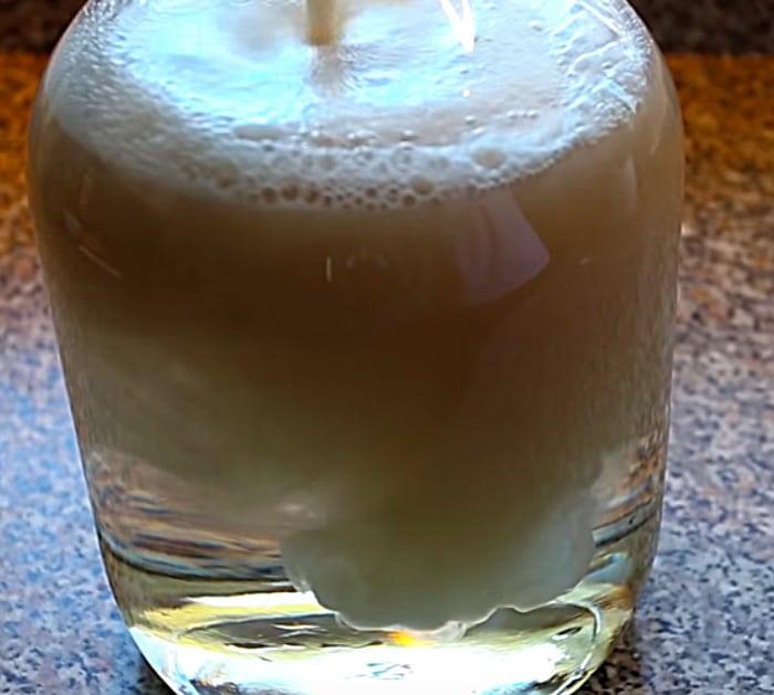 Homemade DIY rubbing alcohol with distilled water and sugar and yeast