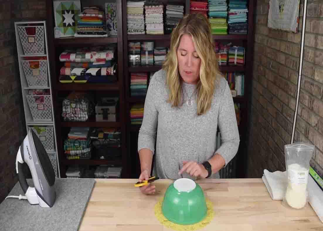 Measuring the fabric with the bowl
