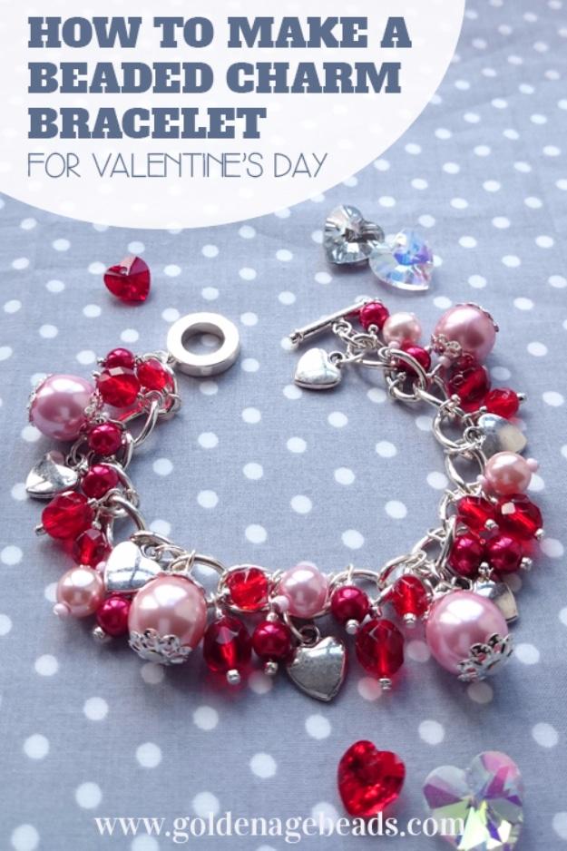Handmade beaded charm bracelet with a heart charm laid on a linen background as a Valentine gift idea for February 14