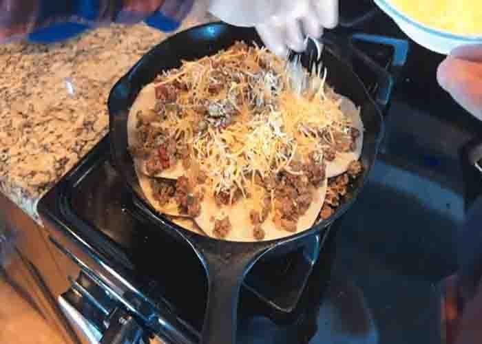 Assembling the Mexican-style skillet lasagna