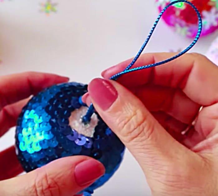 Learn to make a DIY sequined Christmas Ball for your holiday tree with Michales Craft Store Supplies