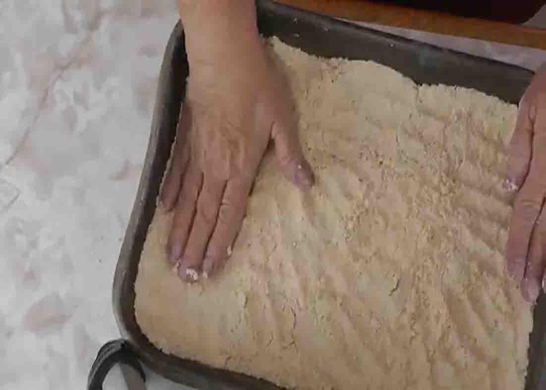 Making the crust for the chocolate delight dessert
