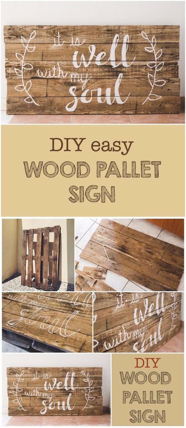 A hand painted sign made from weathered pallet boards leans against a whitewashed wall, lettering sanded soft