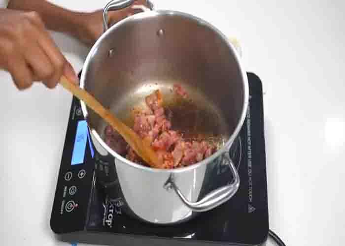 Cooking the bacon for the southern-style collard greens