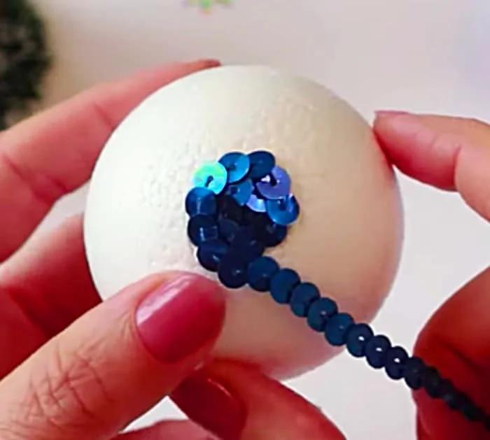 Learn to make a DIY sequined Christmas Ball for your holiday tree with Michales Craft Store Supplies