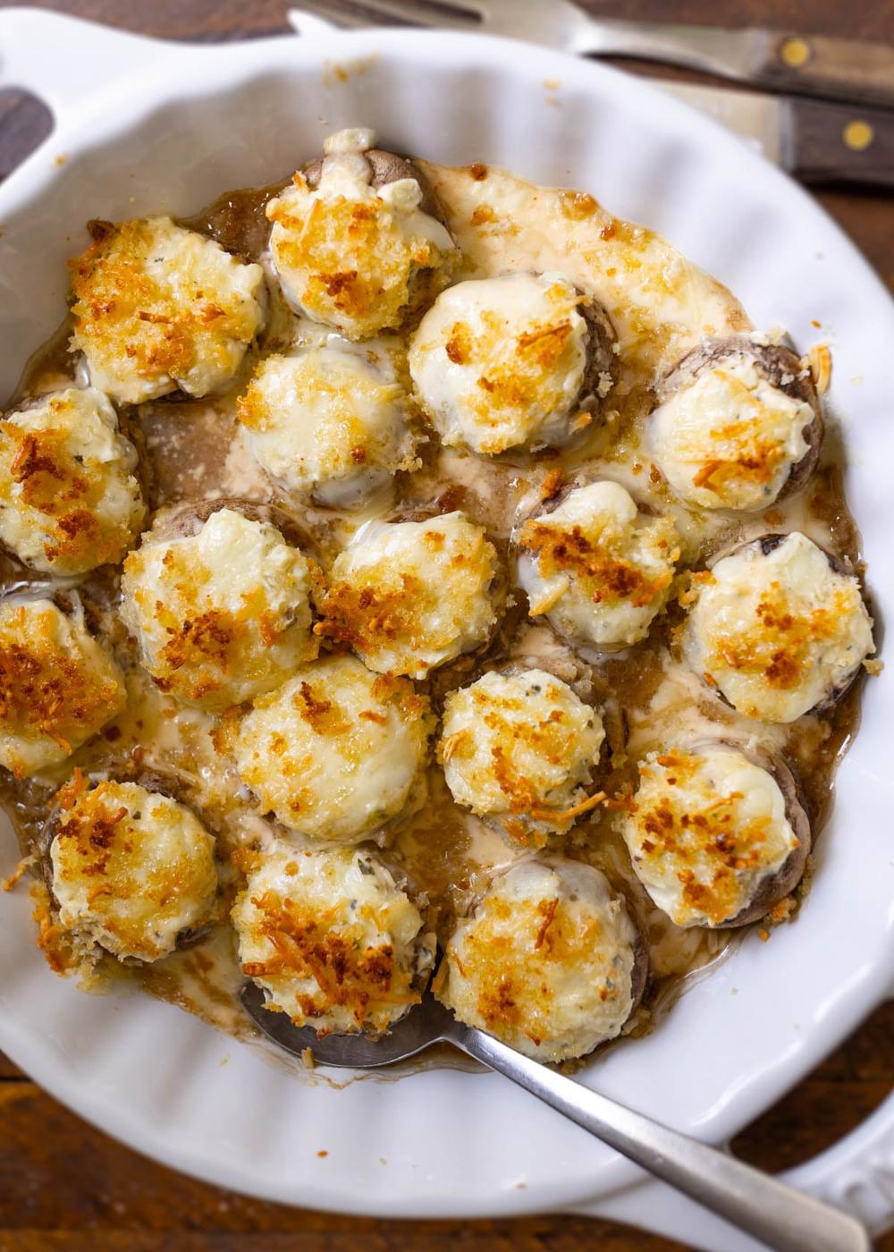 Copycat Longhorn stuffed mushrooms filled with white cheddar cream cheese and a golden parmesan crust