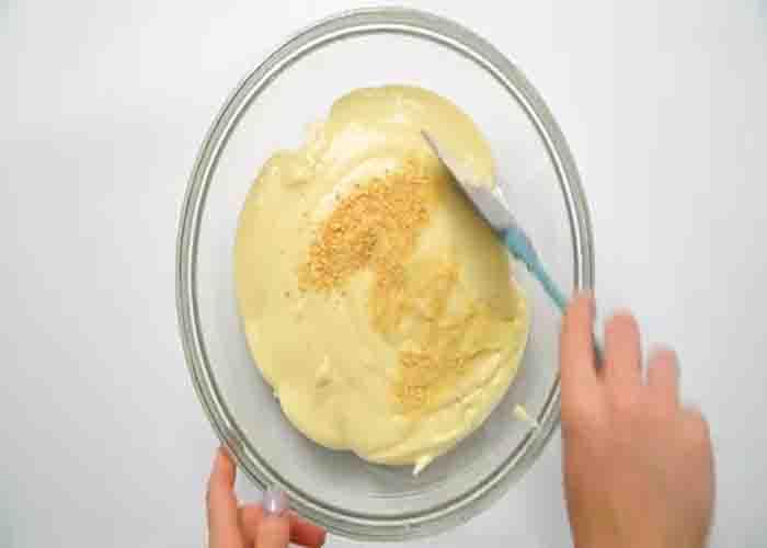 Making the cream cheese layer of the million dollar chicken casserole