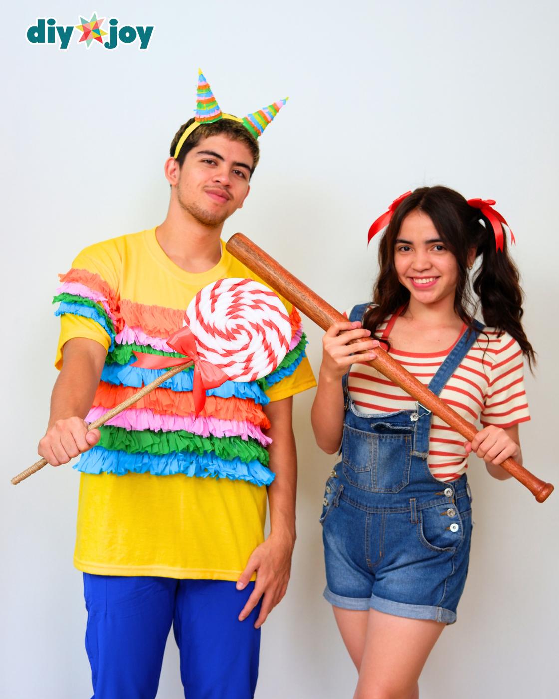 Couples Easy Halloween Costumes - the two friends standing close, the man holding the lollipop prop across the frame.