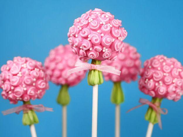 Flower bouquet cake pops decorated as pastel blooms with cupcake liner backers, a Mothers Day dessert