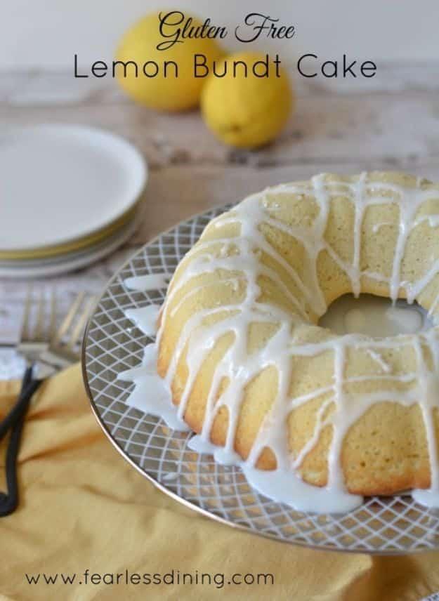 Gluten free lemon bundt cake with a thick lemon icing drizzled down the ridges and fresh grated zest