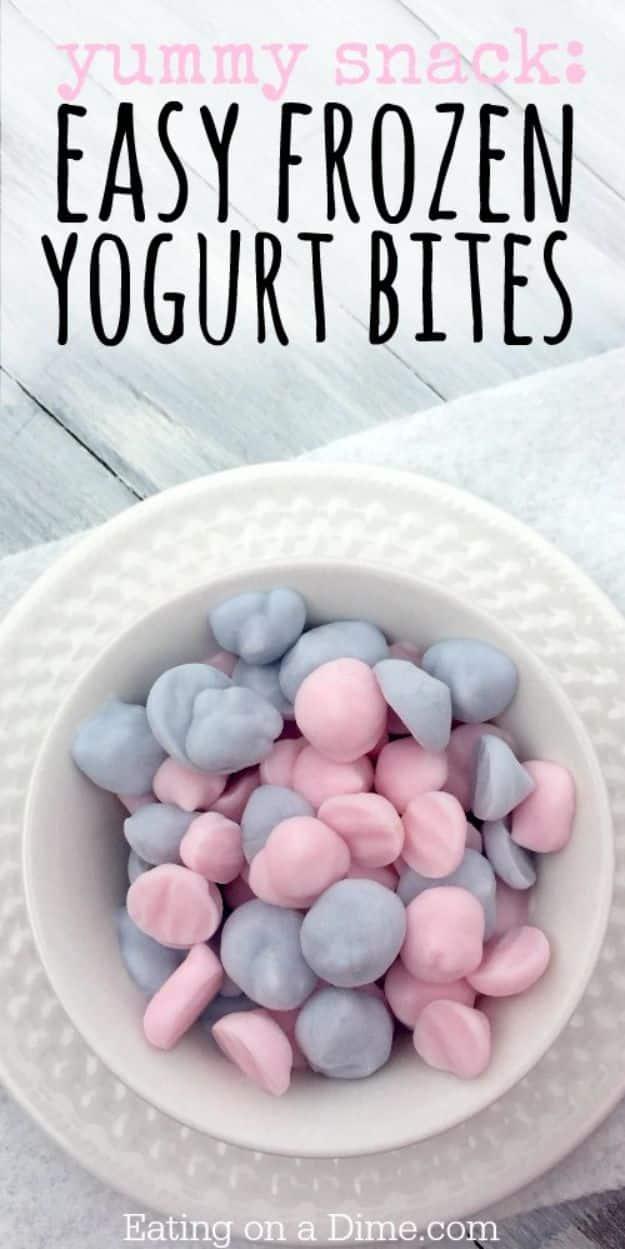 Easy frozen yogurt bites squeezed into small rounds on a lined tray, a one ingredient frozen snack for hot days