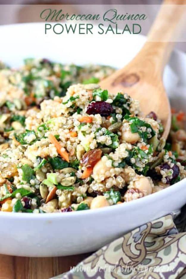 Moroccan quinoa power salad with chickpeas, kale, dried cranberries and toasted pumpkin seeds in a serving bowl