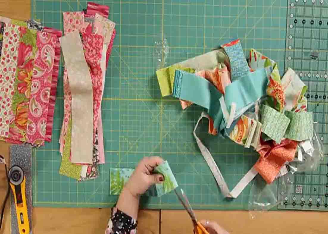 Cutting off the selvages of the jelly roll strips