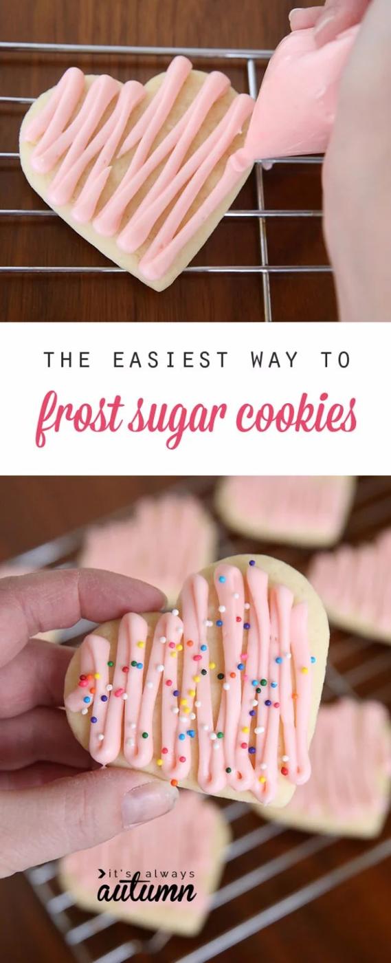 Frosting sugar cookies quickly by piping from a ziplock bag with the corner snipped, filling each cookie