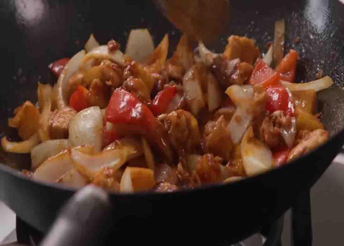 Cooking the sticky pineapple chicken