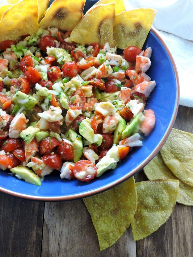 Quick shrimp ceviche with avocado, cherry tomatoes and cilantro served with corn tortilla chips, gluten free