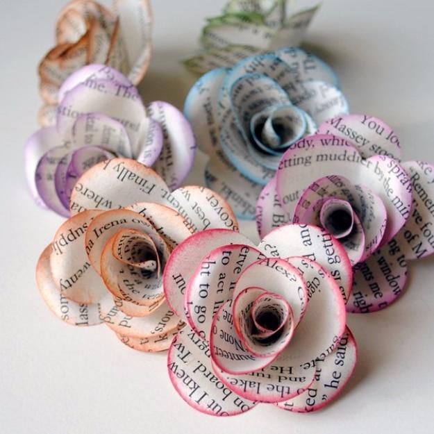 Storybook paper roses, a cluster of roses rolled from printed book pages with pink and blue tinted edges