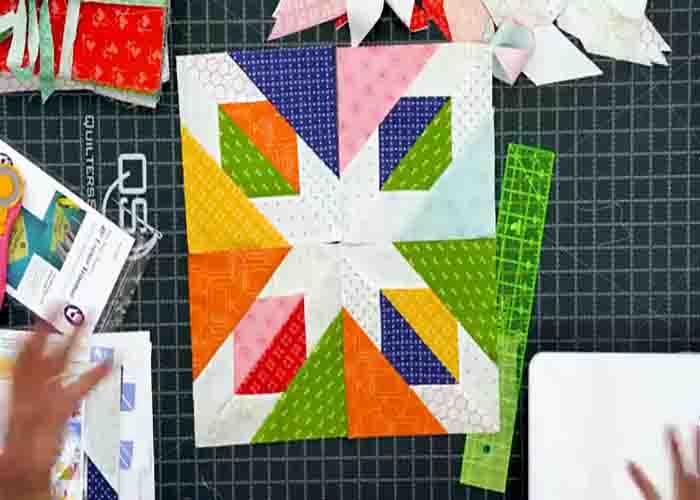 Laying the confetti star quilt top