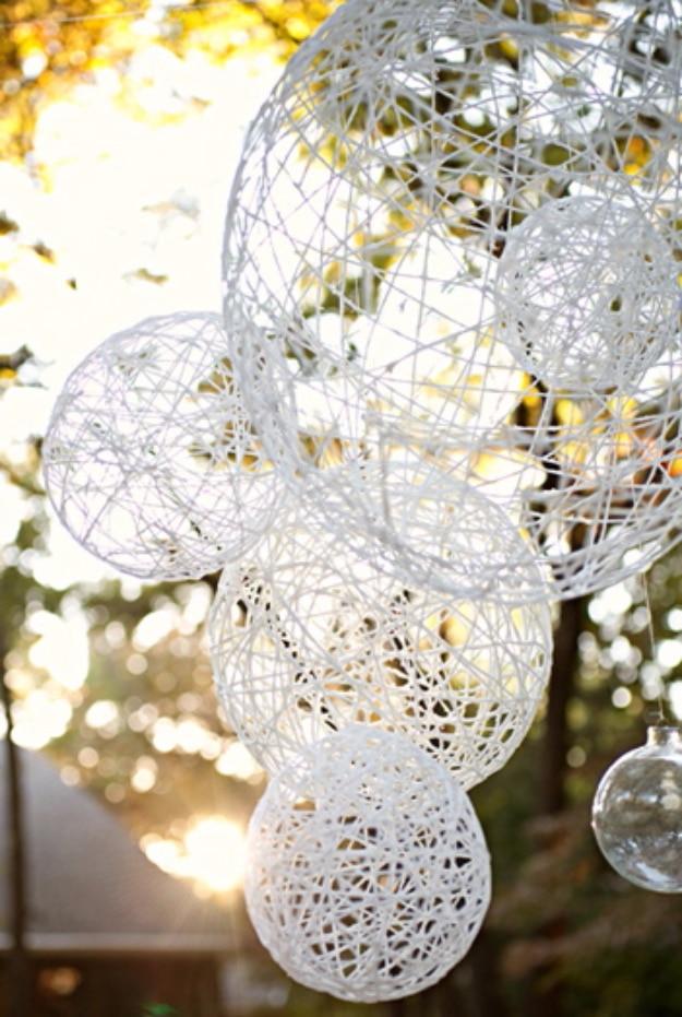 DIY Lantern Chandeliers, a colorful way to use up leftover yarn and a cozy handmade piece for the home