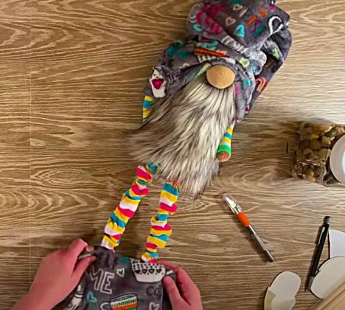Make a long legged gnome out of felt with a beard