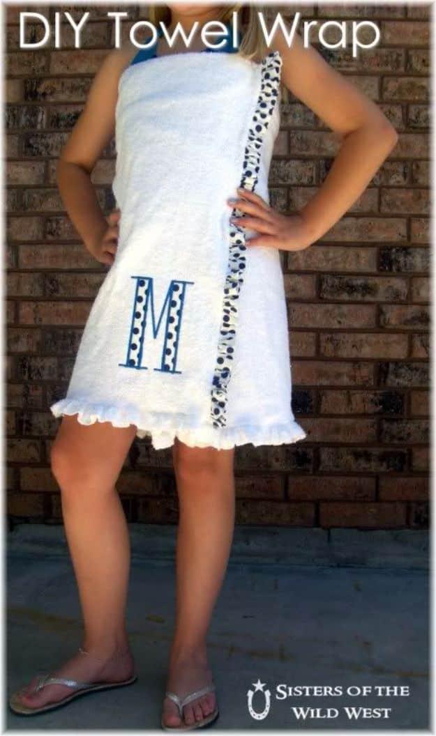 DIY towel wrap graphic showing a white bath towel wrap with a blue monogram, patterned trim and a ruffled hem