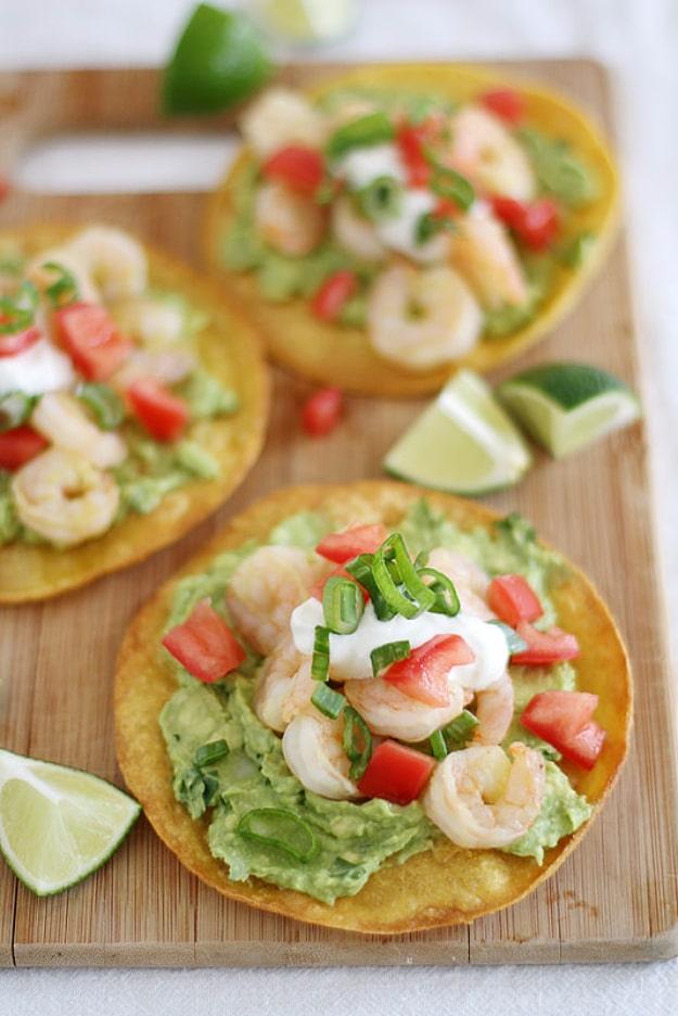 Light zesty shrimp avocado tostadas assembled for a crowd pleasing Fourth of July appetizer for the whole family