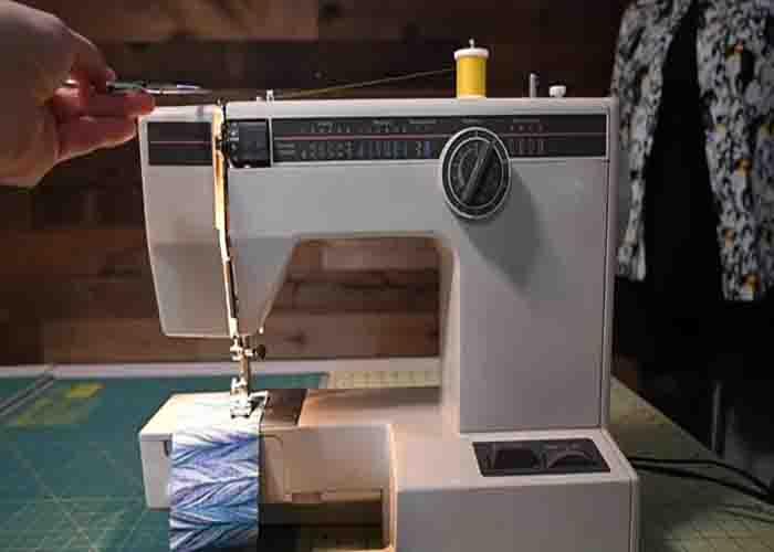 Making sure the takeup lever is high enough to avoid the bobbin thread on getting tangled