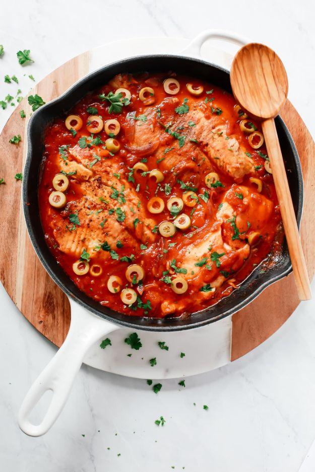 3-ingredient tilapia skillet simmering in diced tomatoes and onions, an easy 20 minute fish dinner recipe