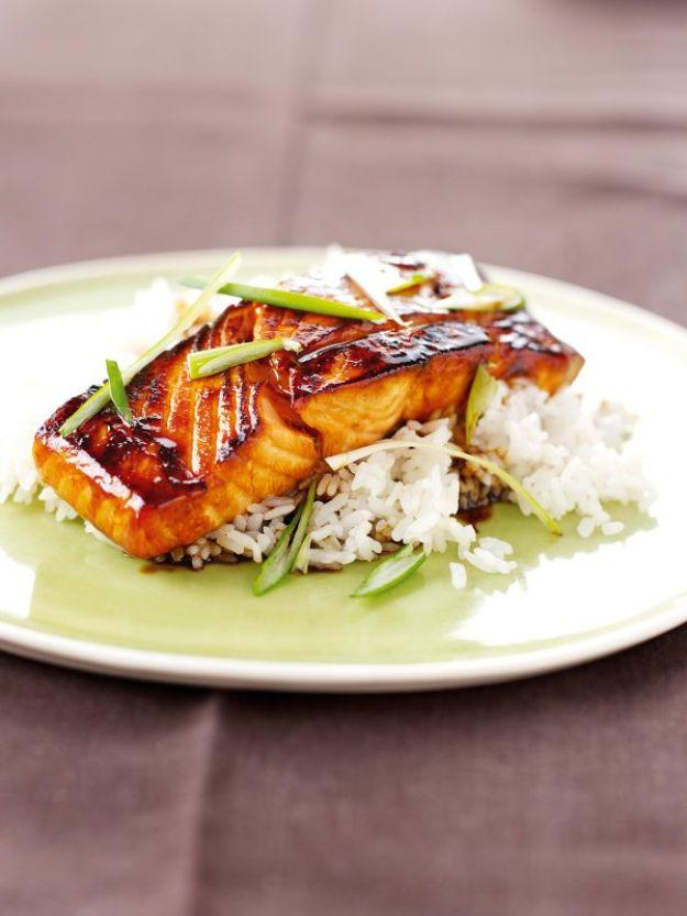 One mirin glazed salmon fillet on white rice with spring onion, a fast celebrity chef salmon dinner recipe