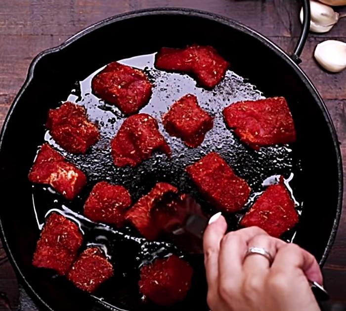 Fry Cajun Steak Bites In Butter In A Cast Iron Skillet