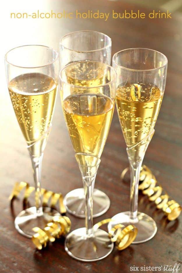 Pin graphic with a text band across the top over four gold plastic flutes of bubbly and curled gold ribbon