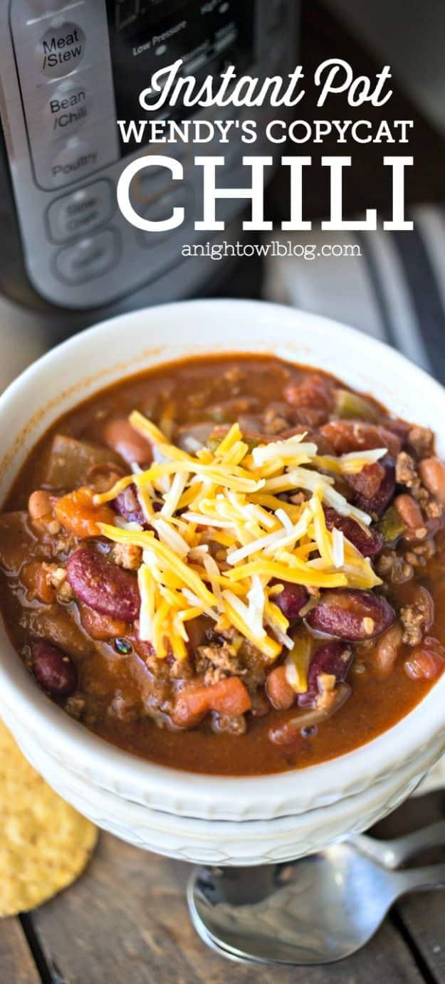 Graphic reading Instant Pot Wendy's Copycat Chili above a white bowl of chili with shredded cheddar on top