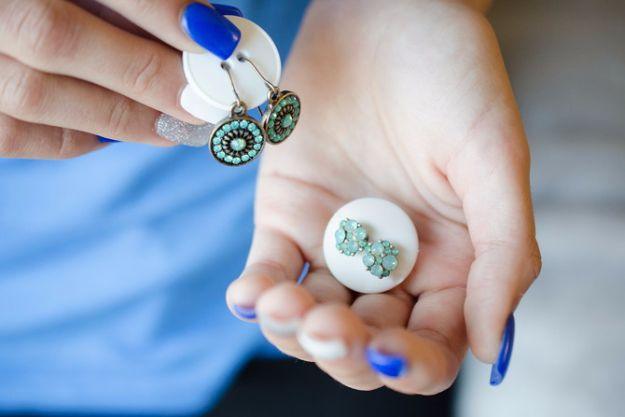 Packing Tips for Travel - Keep A Pair Of Earrings Together With A Button - Easy Ideas for Packing a Suitcase To Maximize Space - Tricks and Hacks for Folding Clothes, Storing Toile