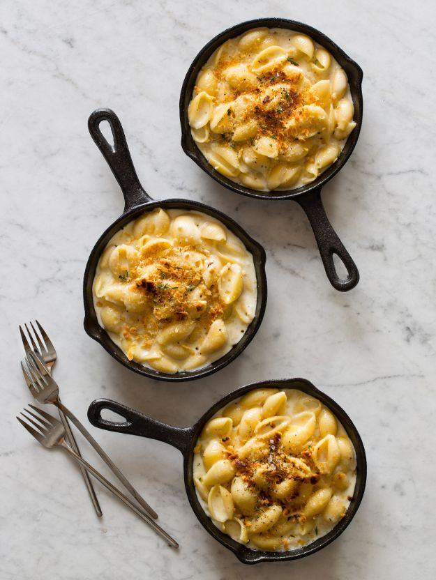 Creamy skillet mac and cheese made with brie and white cheddar, served in three small cast iron skillets
