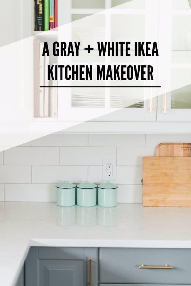 Grey lower cabinets with gold pulls, white uppers with glass fronts, white subway tile and mint canisters on a quartz counter